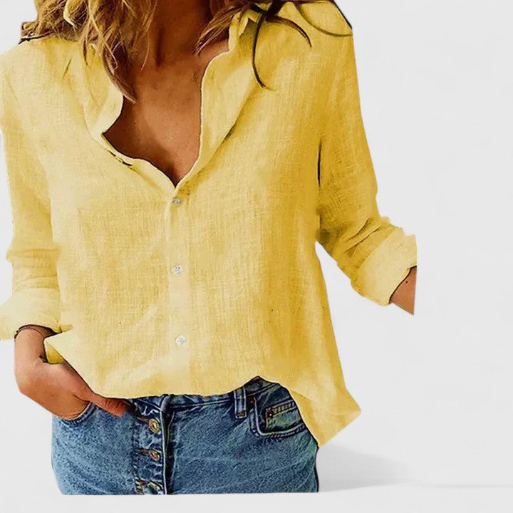 Comfortabele en elegante damesblouse met lange mouwen en golvende revers, perfect voor office wear.