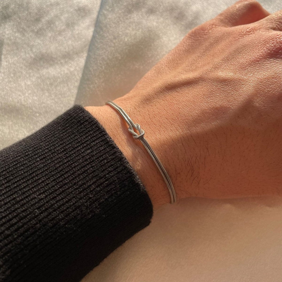 Livia armband voor dames, goudkleur, met liefdesknoop design.