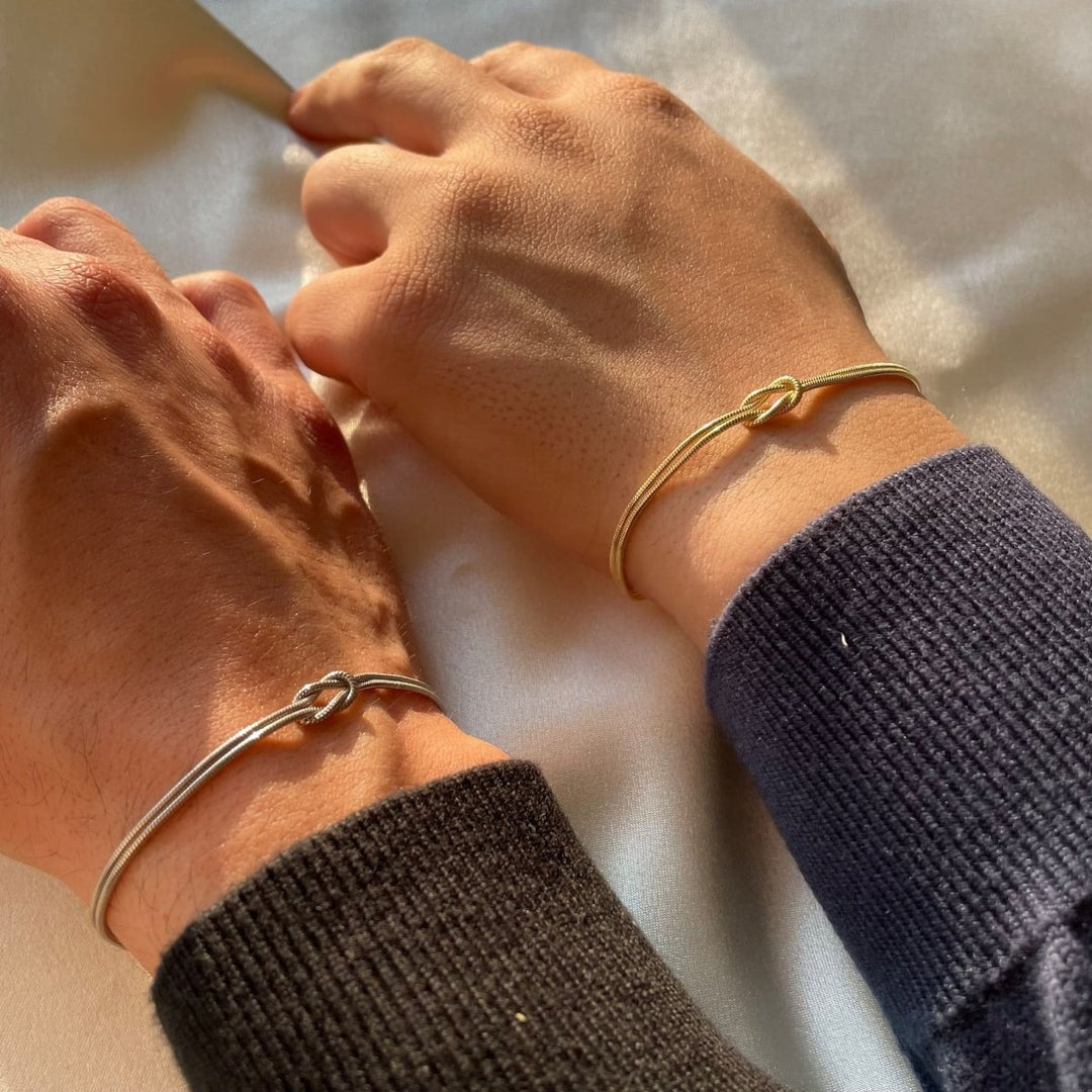 Damesarmband met liefdesknoop, verstelbaar, zilverkleur.