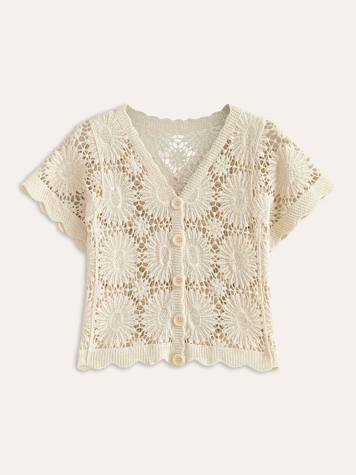 Elegant damesvest met bloemenpatroon en knoopsluiting, perfect voor tussenseizoen mode.