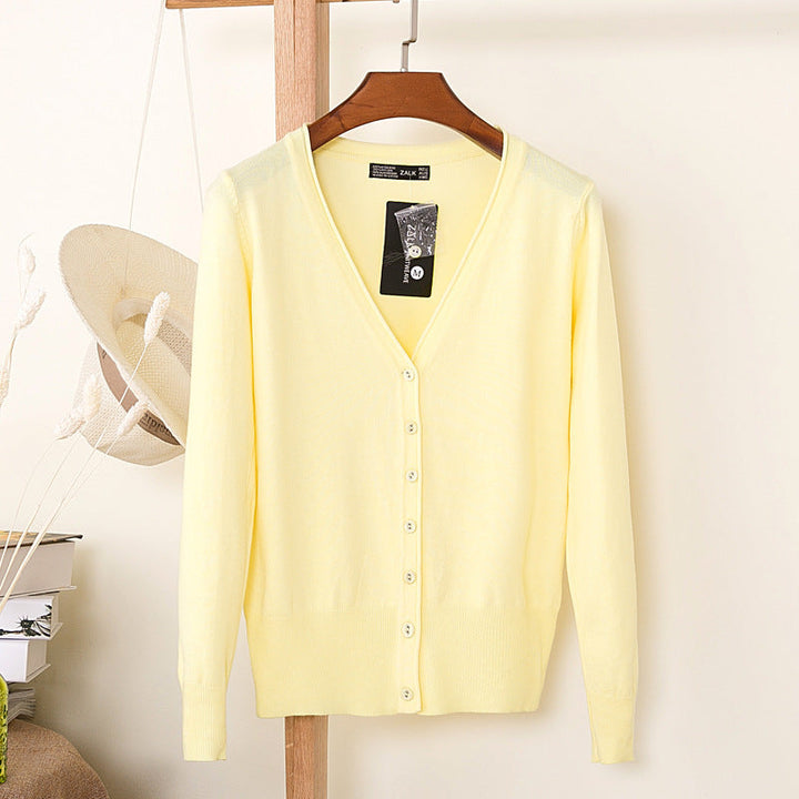 Elegant pastel damesvest met V-hals, knoopsluiting; ideaal voor lente/zomer.