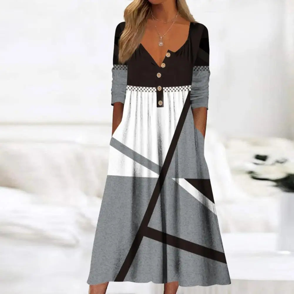 Elegante A-lijn midi jurk met levendige bloemenprint en praktische zakken, ideaal voor zomerse en stijlvolle dagen.