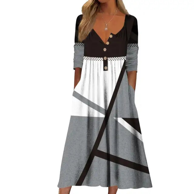 Elegante A-lijn midi jurk met levendige bloemenprint en praktische zakken, ideaal voor zomerse en stijlvolle dagen.