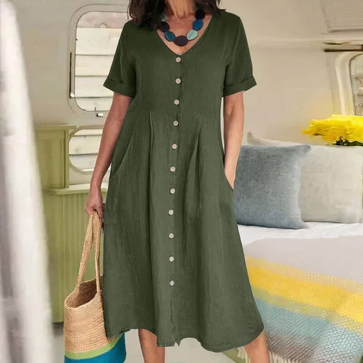 Casual V-hals midi zomerjurk met knoopjes en zakken, ideaal voor een ontspannen dag.