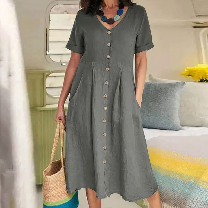 Perfecte zomerse V-hals midi jurk voor dames met A-lijn pasvorm, inclusief handige zakken.
