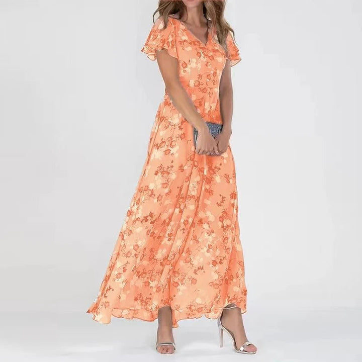"Elegante chiffon jurk met bloemig patroon, subtiele V-hals en ruffles, ideaal voor zomerse gelegenheden."