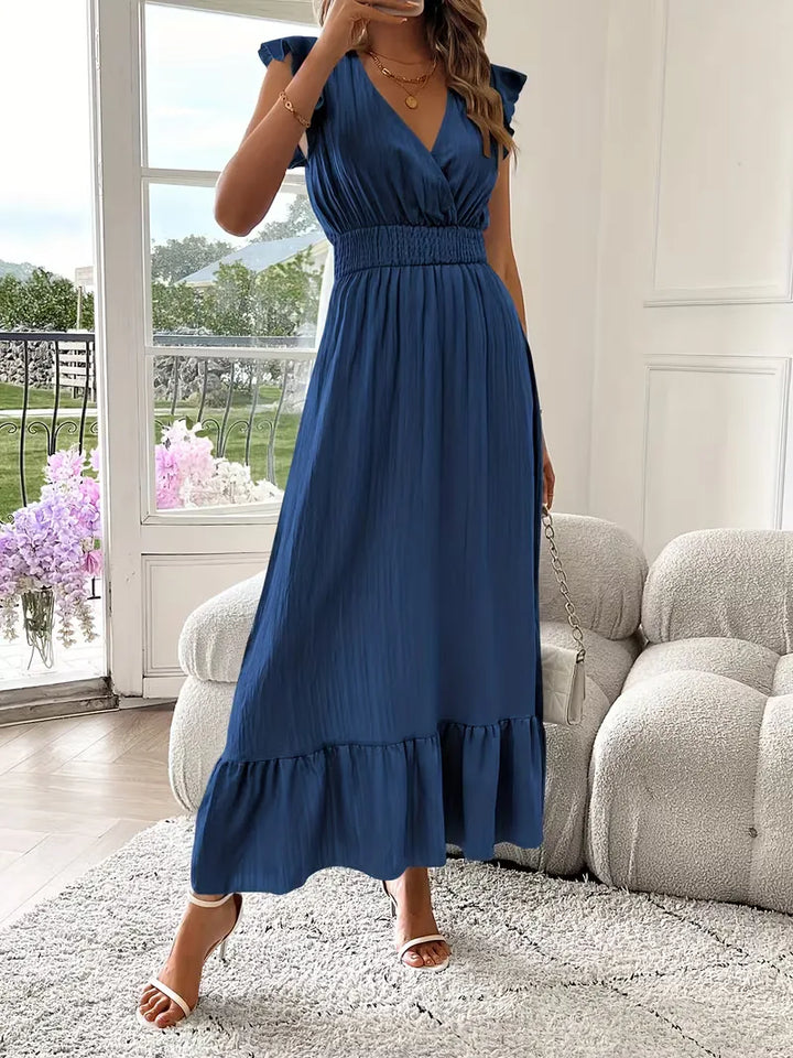Deze prachtige damesjurk, V-hals en gelaagde maxi rok, is perfect voor elke feestelijke gelegenheid.