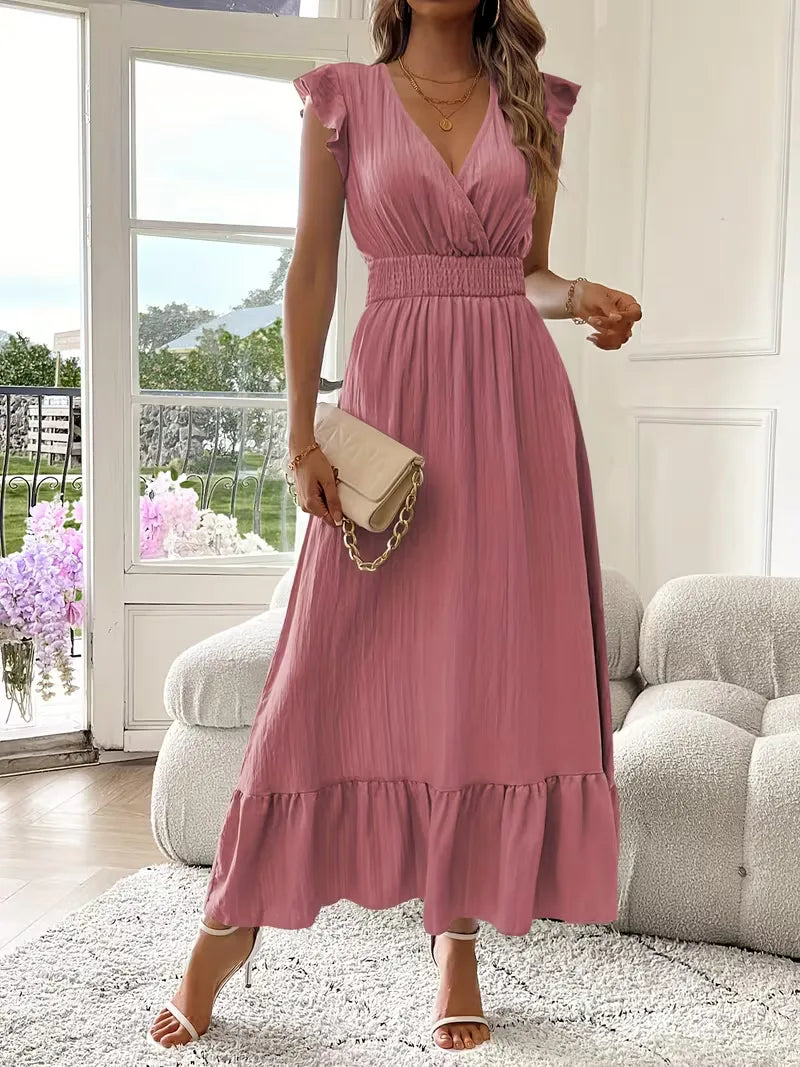 Zomerse avondjurk, V-hals en gelaagde maxi rok, perfect voor een cocktailparty of gala.