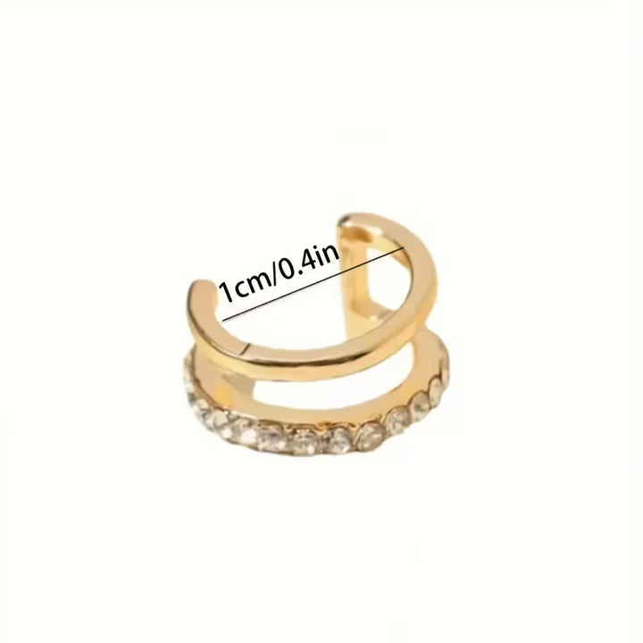 Luxe dames sieraden: gouden clipoorbellen bezet met heldere stenen, voor een verfijnde uitstraling.