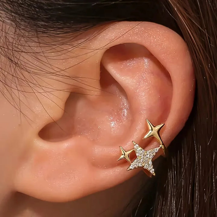Set zilveren en gouden clip-on oorbellen met diverse stenen en unieke, stijlvolle designs voor dames.