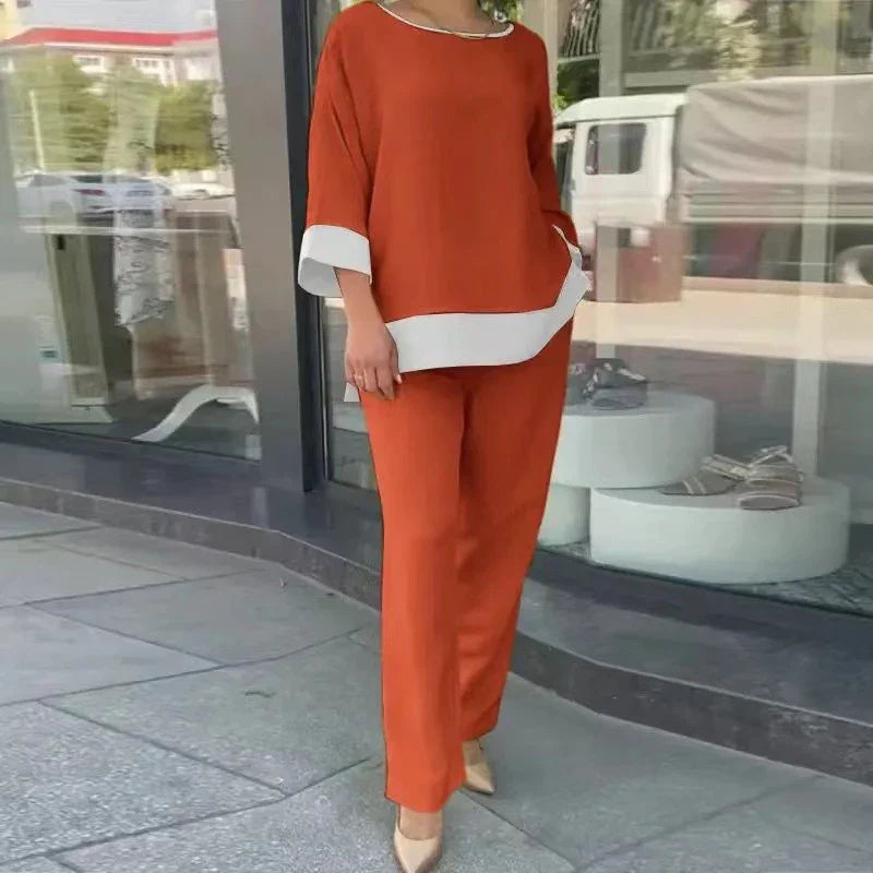 Stijlvolle dames co-ord set voor de lente. Een elegante top en rechte broek creëren een casual chique zomer outfit.