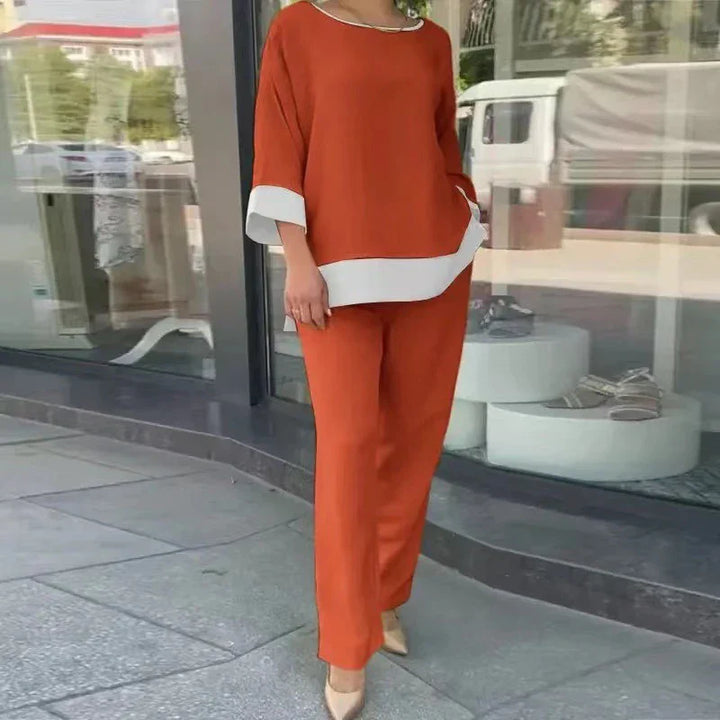 Stijlvolle dames co-ord set voor de lente. Een elegante top en rechte broek creëren een casual chique zomer outfit.