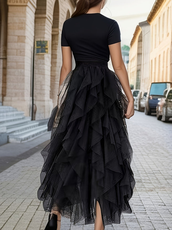 Stijlvolle zwarte maxi rok voor dames, met gelaagde stof en comfortabele elastische taille, ideaal voor casual.