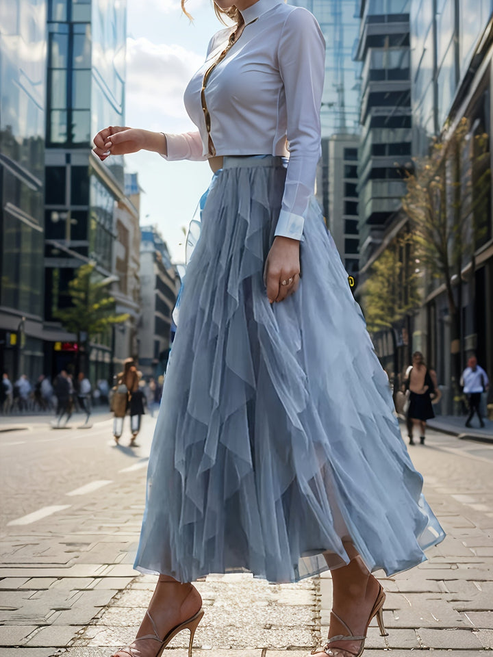 Roze gelaagde maxi rok voor elegante dames, met soepele stof en elastische taille, ideaal voor de zomer.