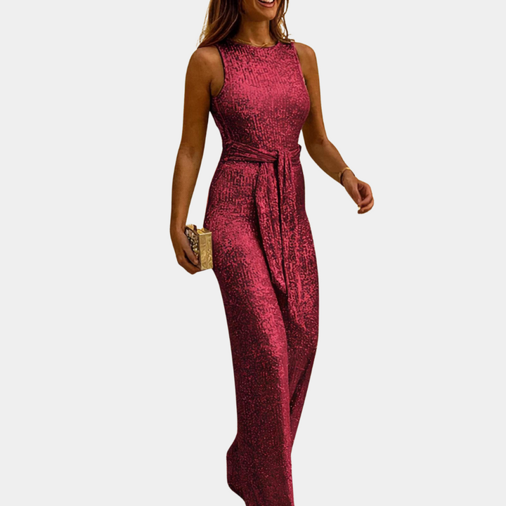 Sprankelende dames jumpsuit met glitter, een elegante keuze voor avondkleding en feestelijke gelegenheden. Chique design.