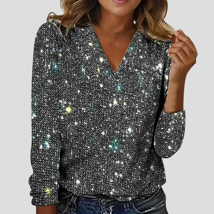 Elegante dames glitterblouse met V-hals en lange mouwen, perfect voor feestelijke avondkleding.