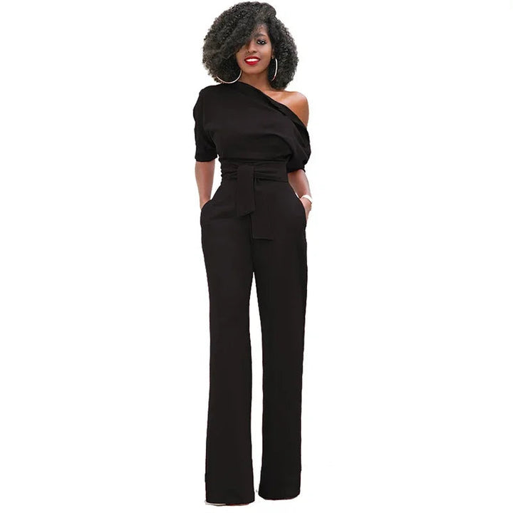 Chique dames feestjumpsuit, open schouder met strikband en wijde pijpen. Creëert een elegante, flatterende silhouet.