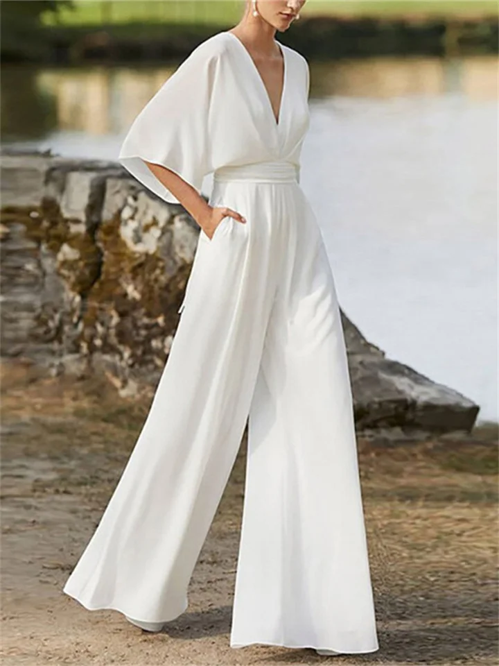Elegante dames jumpsuit met V-hals, wijde pijpen en vleermuismouwen, ideaal voor zomer en lente outfits.
