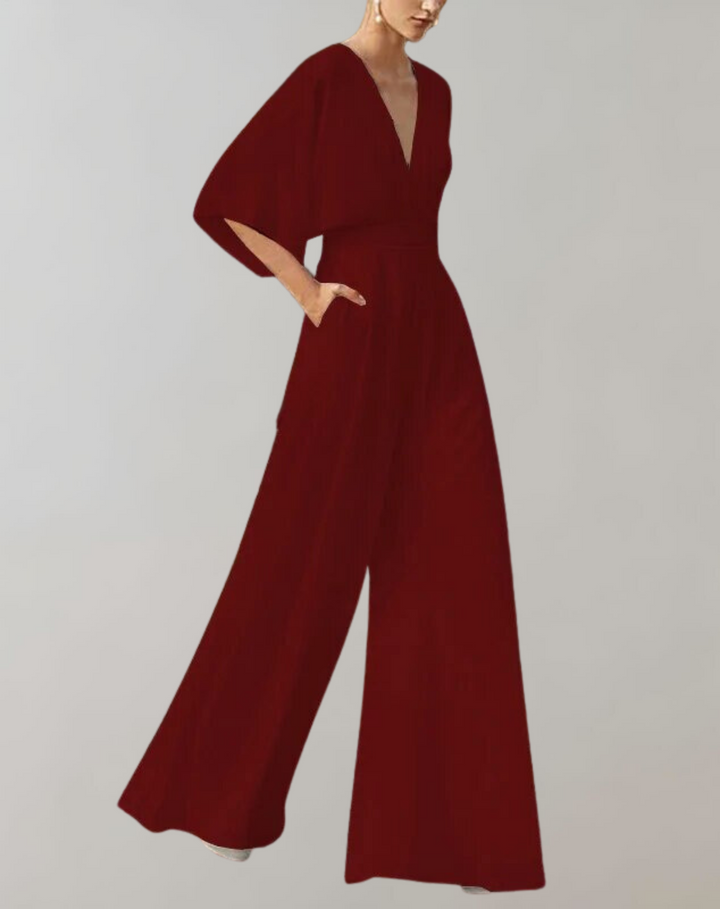 Avondkleding dames: jumpsuit met V-hals, elegante snit en wijde pijpen voor een chique uitstraling.
