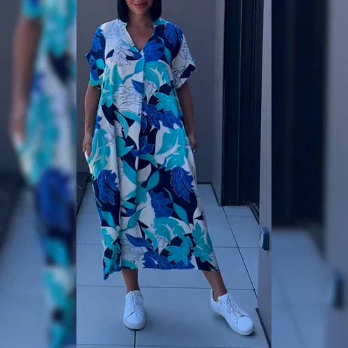 Modieuze dames kaftan jurk, midi lengte, speciaal voor de zomer. Vloeiende vrouwenmode met elegant design.