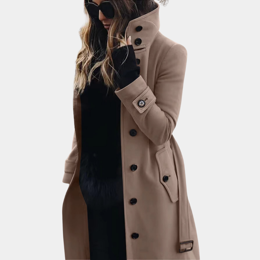 Elegante dames lange trenchcoat met riem en hoge kraag. Stijlvolle overgangsjas voor herfst/winter.