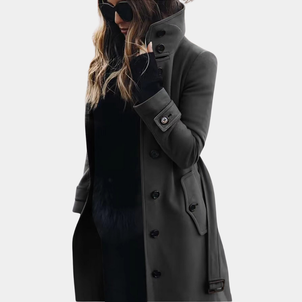 Veelzijdige dames trenchcoat, ideaal als herfstjas of winterjas. Lange snit met riem en comfortabele hoge kraag.