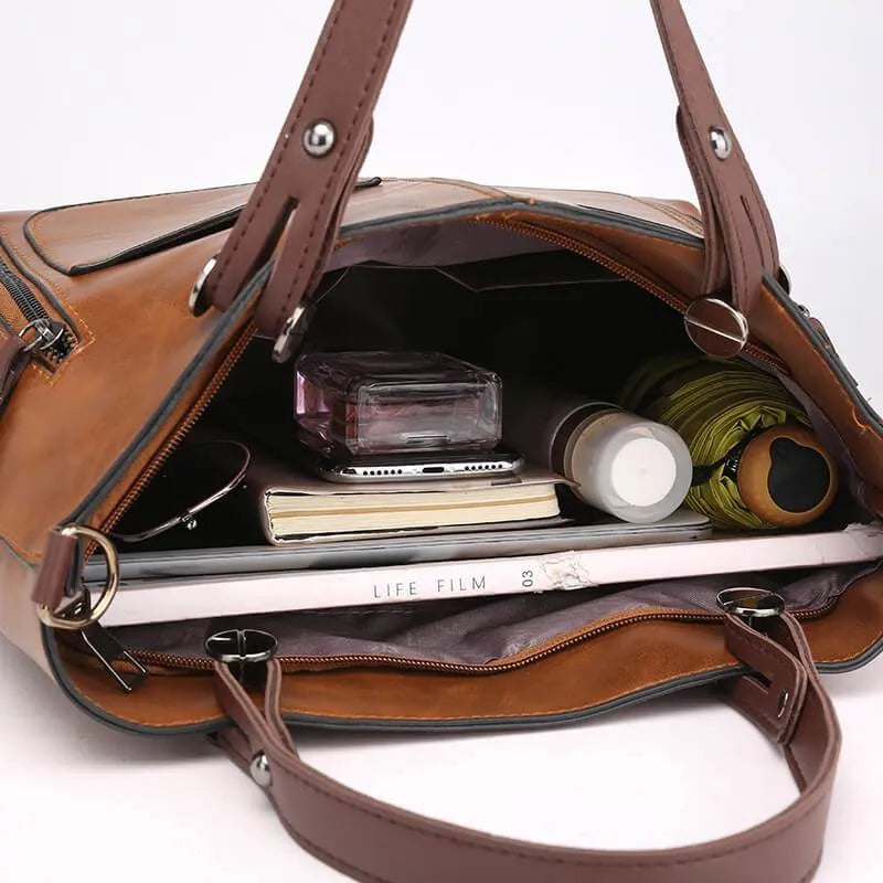 Grijze leren schoudertas, moderne dames handtas. Veelzijdig en stijlvol, een luxe accessoire voor de modebewuste vrouw.