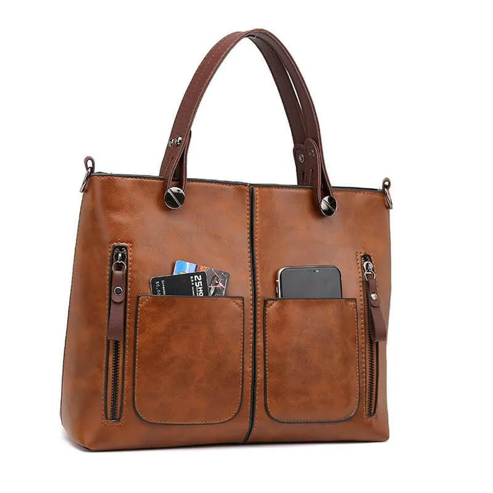 Open leren schoudertas met ruim interieur. Praktische en stijlvolle dames handtas voor al je essentials.