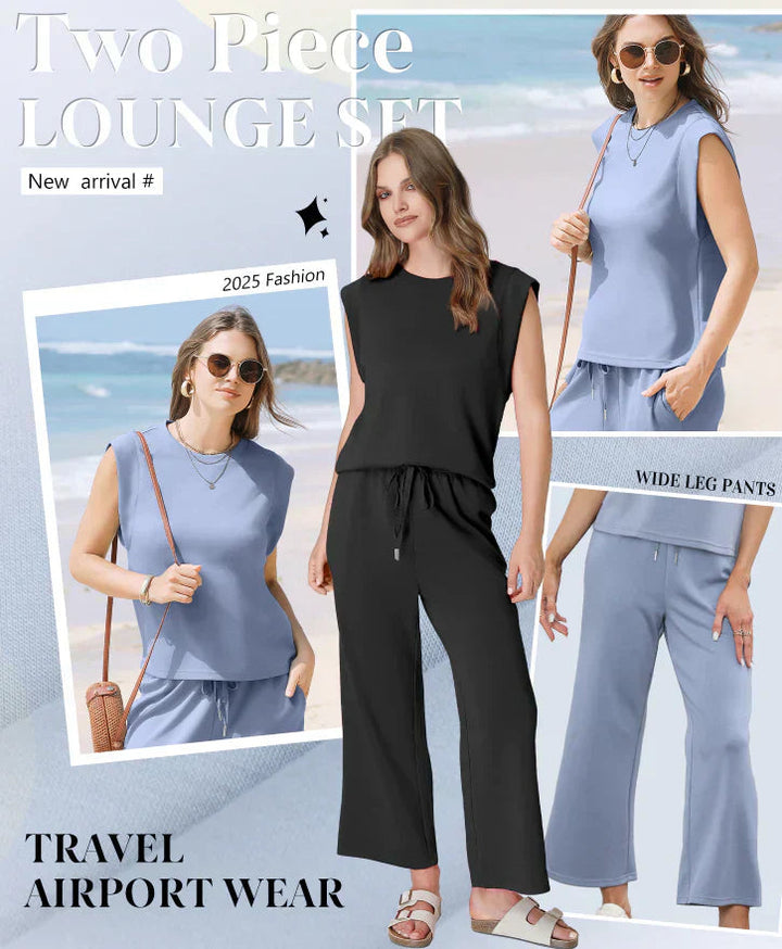 Model draagt comfortabele tweedelige dames loungewear set: elegante top en wijde broek.