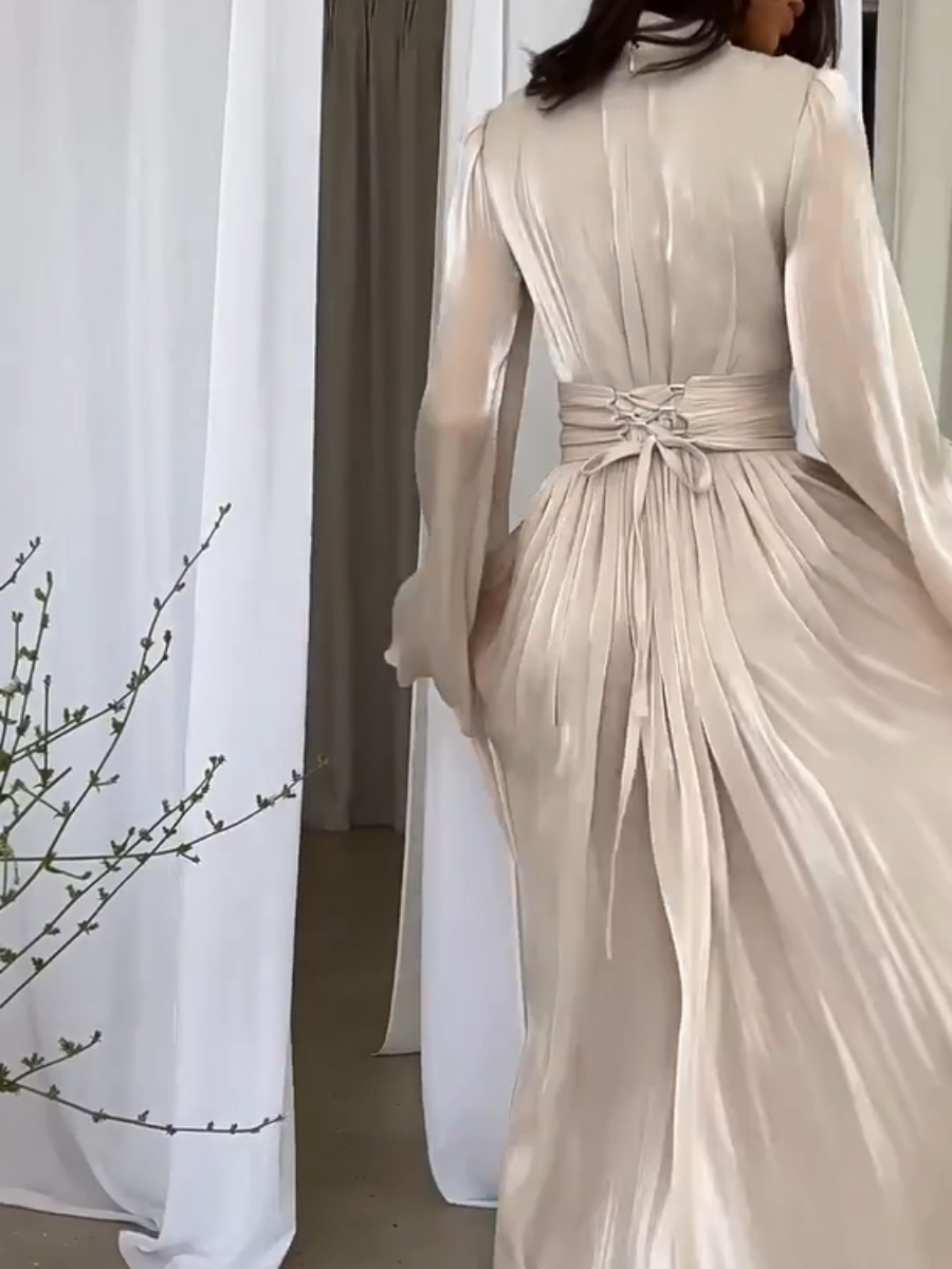 Dames galajurk: een elegante plooi maxi jurk met strikceintuur, perfect voor chique evenementen en diners.