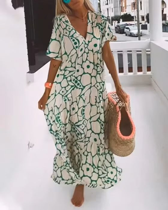 Elegante dames maxi jurk met V-hals voor de zomer, comfortabel en stijlvol voor elke gelegenheid.