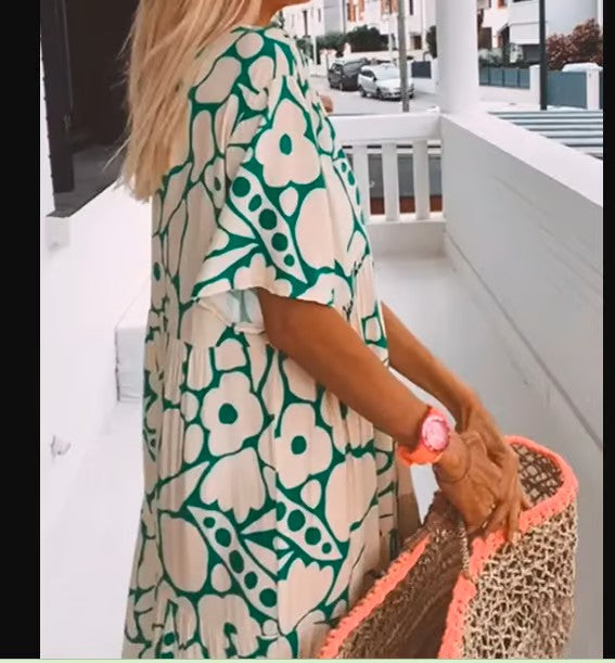 Trendy vrouwelijke V-hals zomerjurk, lange en veelzijdige damesjurk, perfect voor casual of feestelijk.