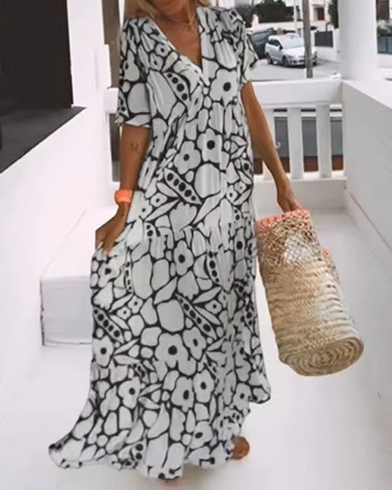 Lange mouwloze dames maxi jurk met V-hals, veelzijdig te dragen als casual zomerjurk of feestelijke outfit.