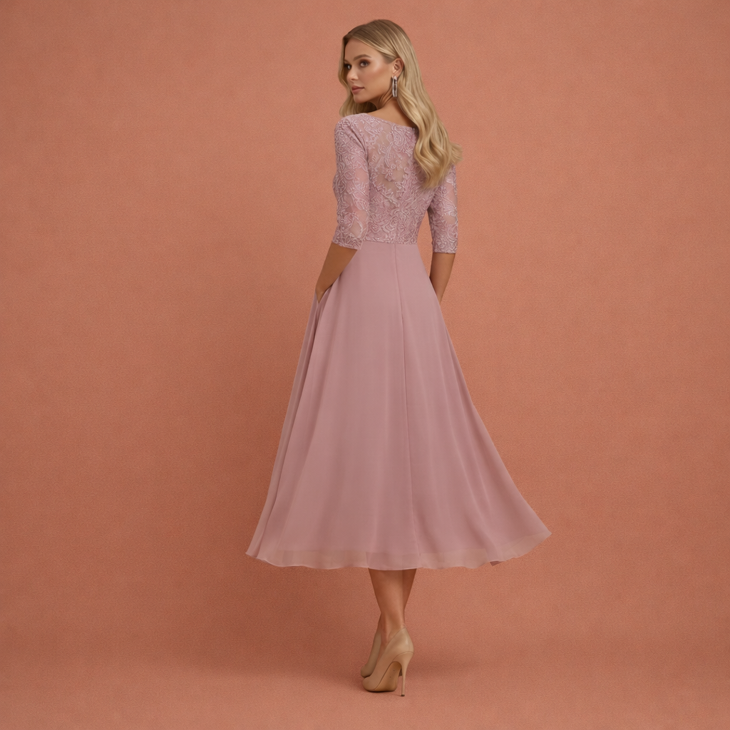 Stijlvolle dames gala jurk: midi lengte, kant detail, gelaagde rok. Ideaal als feestjurk.
