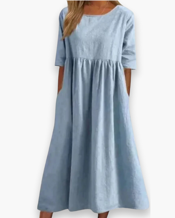 Dames midi-jurk met halve mouwen, ronde hals en handige steekzakken; ideaal voor elke dag.