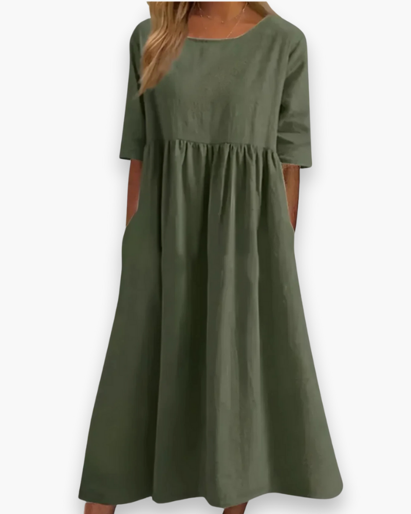 Stijlvolle effen midi-jurk met geplooide rok en halve mouwen; een elegante keuze voor vrouwen.