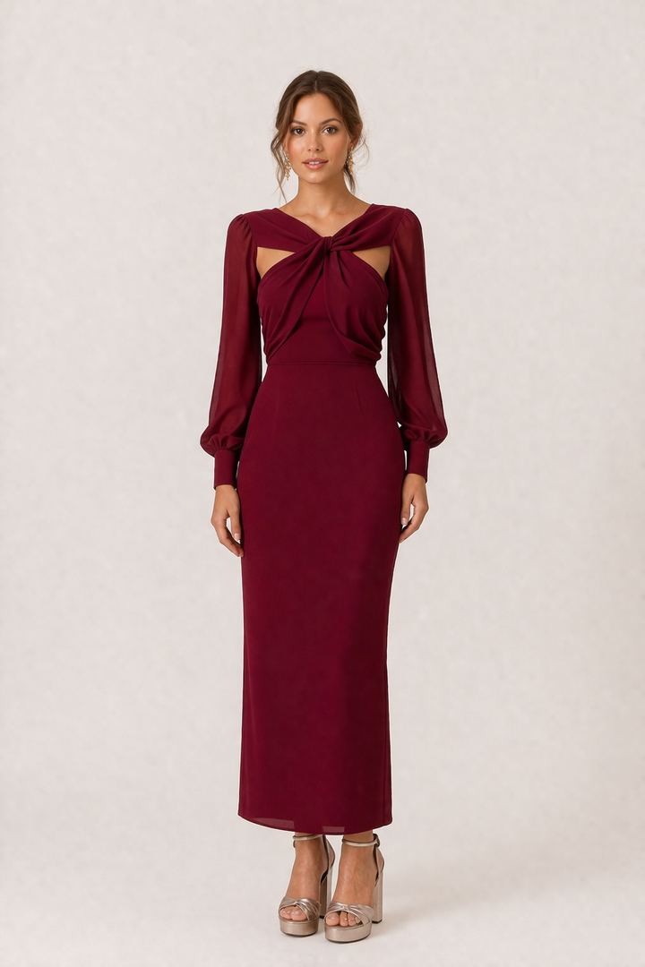 Stijlvolle damesjurk: midi-lengte, lange mouwen en elegant knoopdetail aan de taille. Ideaal voor een verfijnde look.