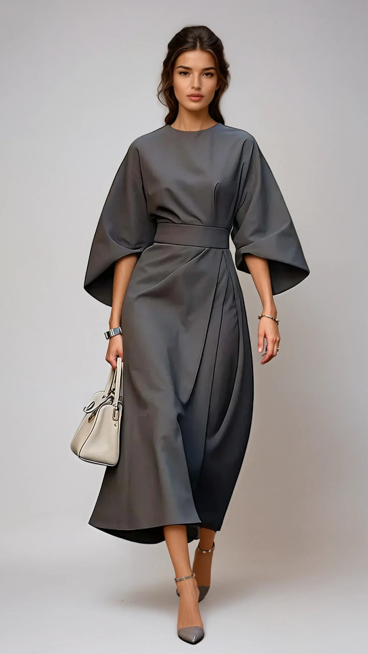 Elegante dames midi jurk met tijdloze pasvorm en opvallende lantaarnmouwen. Stijlvolle damesmode voor elke gelegenheid.