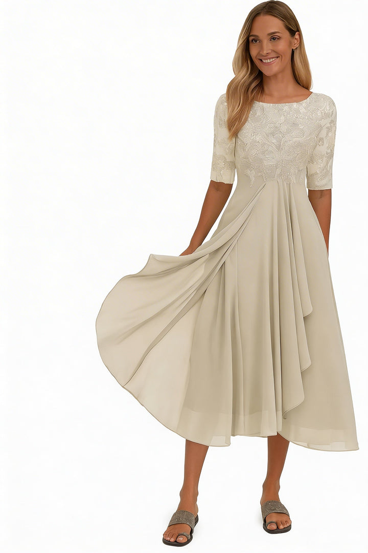 Elegante dames midi jurk met verfijnd bovenstuk en zwierige rok, perfect voor een chique avond.