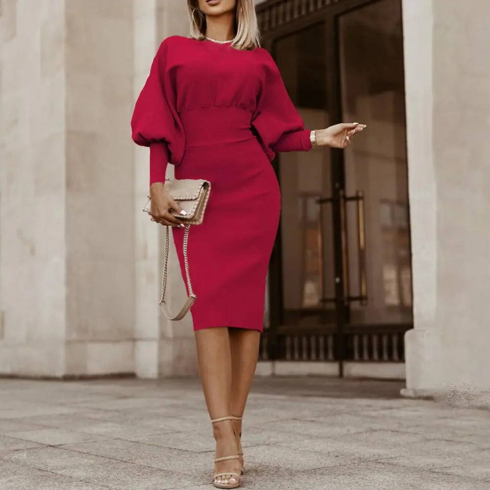 Elegante dames midi kantoorjurk met lantaarnmouw, ideaal voor een stijlvolle werklook.