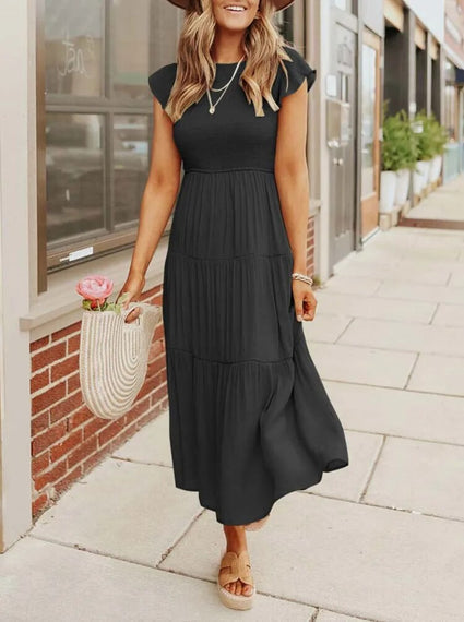 Dames zomerjurk met vlindermouwen, midi model, elegant en flatterend, een modieuze eyecatcher.