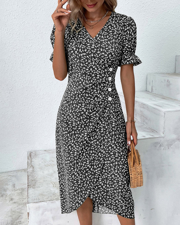 Elegante dames midi zomerjurk met V-hals en korte mouwen, ideaal voor casual en zomerse gelegenheden.