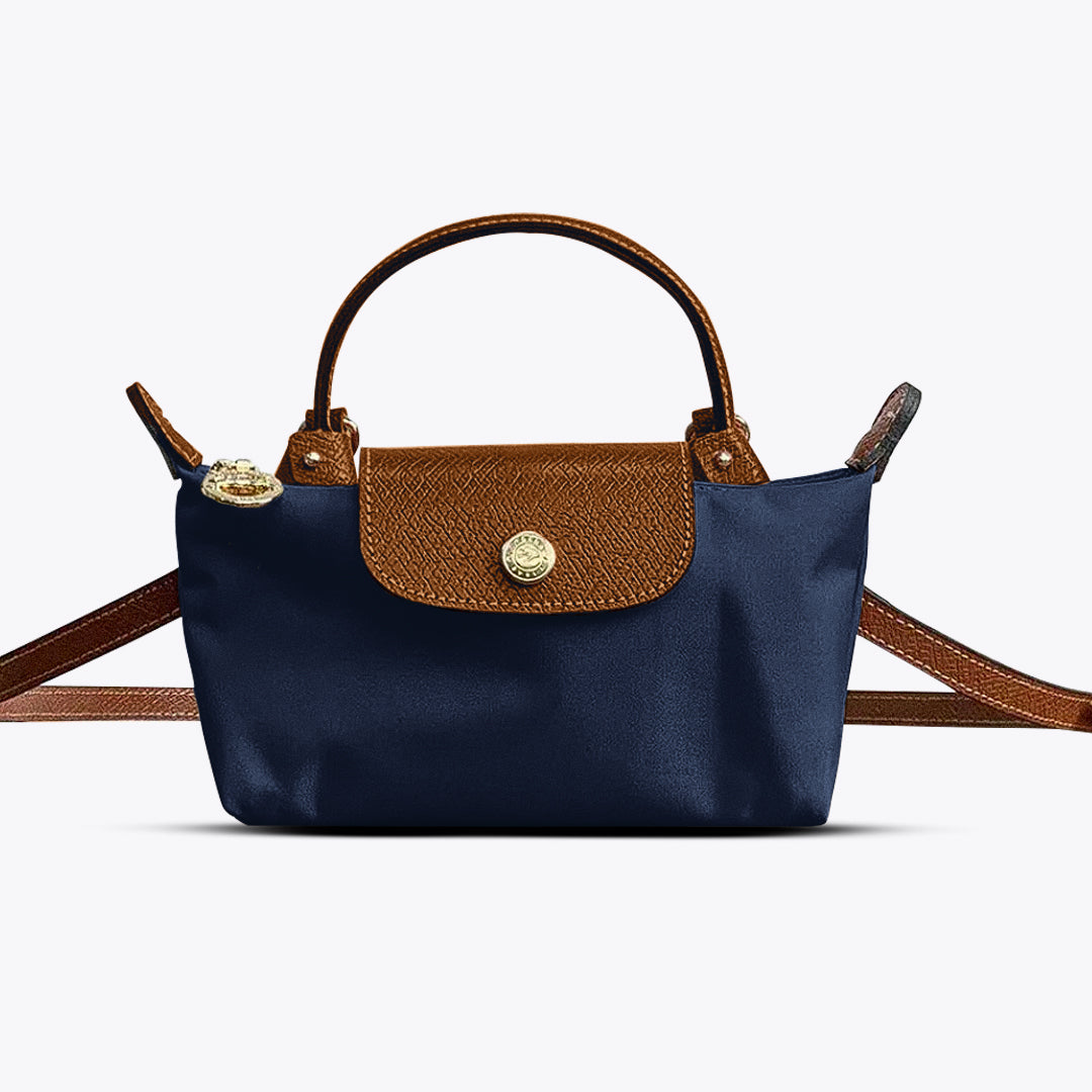 Stijlvolle compacte dames schoudertas in mini formaat, trendy accessoire voor een moderne outfit.