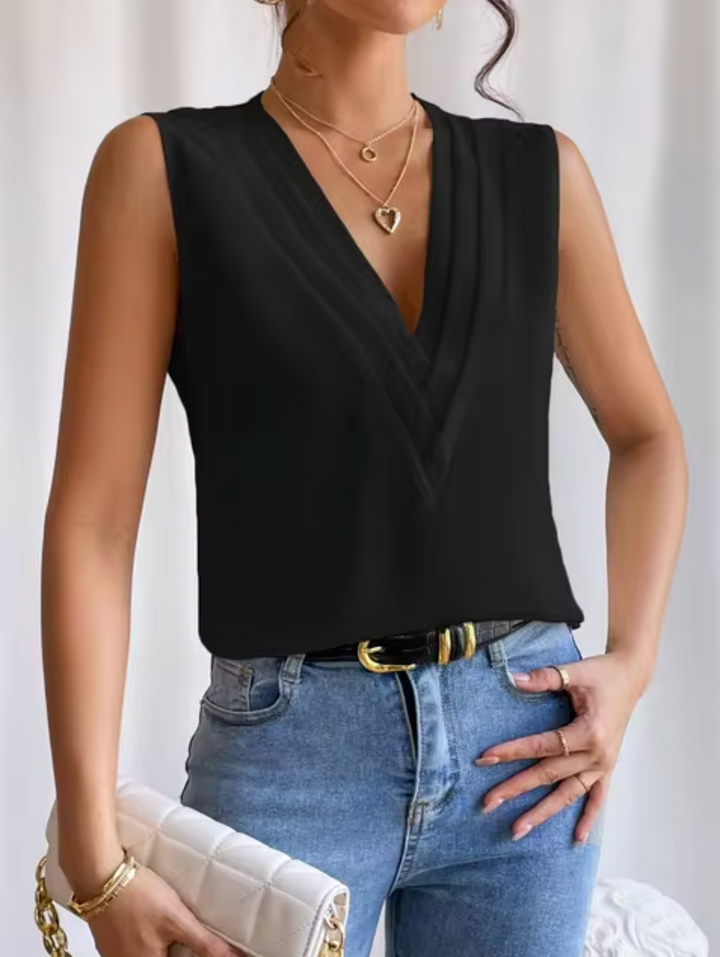 Trendy dames mouwloze V-hals blouse, ideaal voor een elegante en luchtige zomerse outfit.