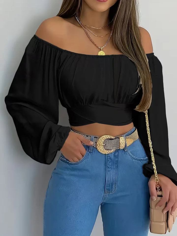 Modieuze lente/zomer off-shoulder damesblouse met strikjes, perfect voor een casual of smartcasual look.