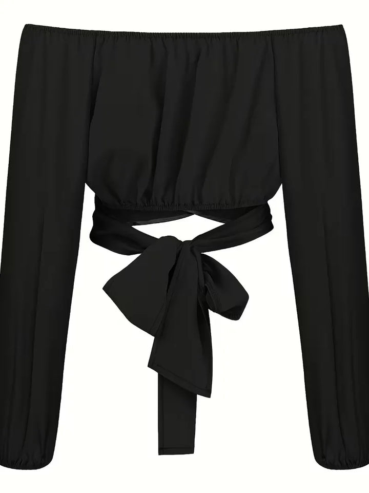 Comfortabele en elegante off-shoulder blouse met lange mouwen en strikdetails voor dameskleding.