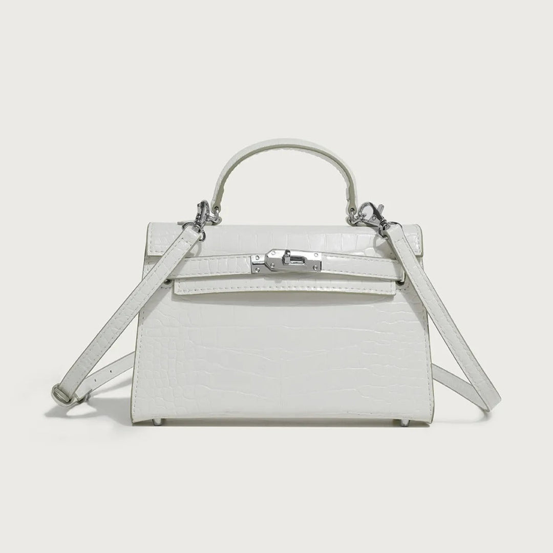 Trendy witte veganistisch leren handtas voor dames, ook te dragen als elegante crossbody schoudertas.