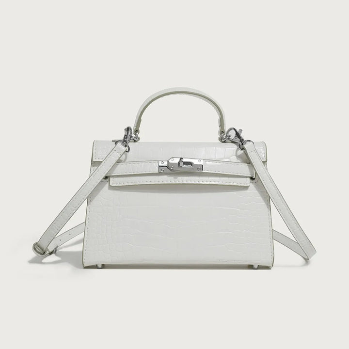 Trendy witte veganistisch leren handtas voor dames, ook te dragen als elegante crossbody schoudertas.