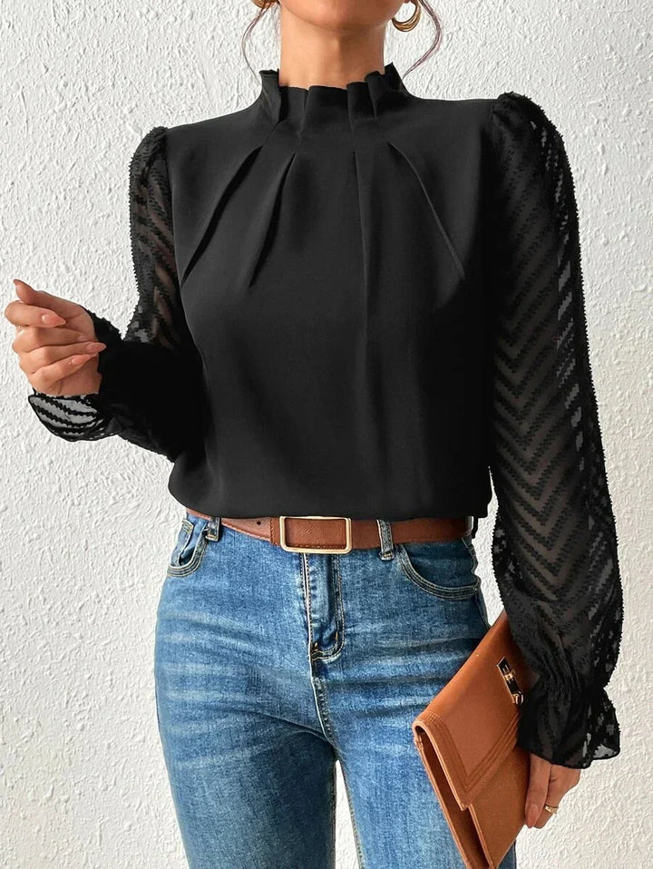 Comfortabele damesblouse met lange mouwen, opstaande hals en elegante plooien. Perfect voor dagelijks gebruik.