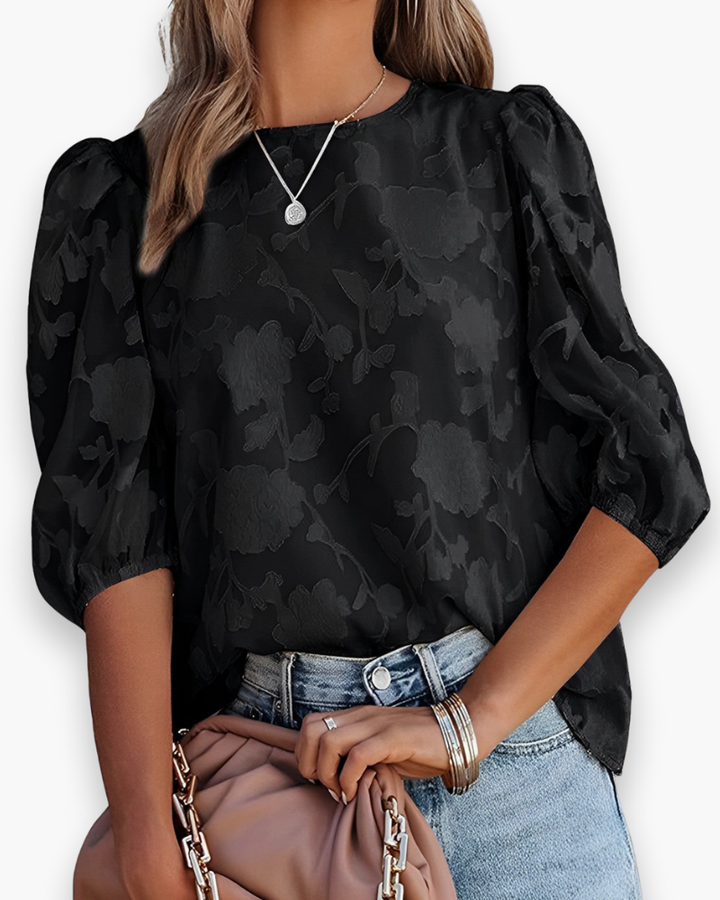 Vrouwelijke dames top met chique pofmouwen, voegt een elegante en luchtige touch toe aan elke outfit.